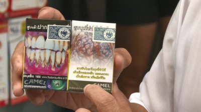 泰国烟品包装统一 烟盒放重口味警示图案